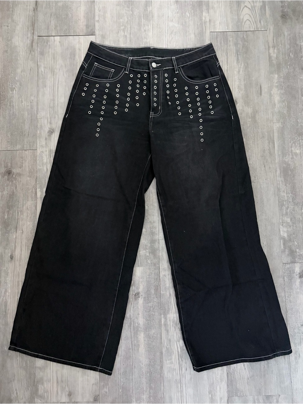 black baggy jeans with silver grommets